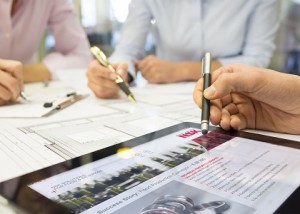 Close-up of Team architects working on construction project in o