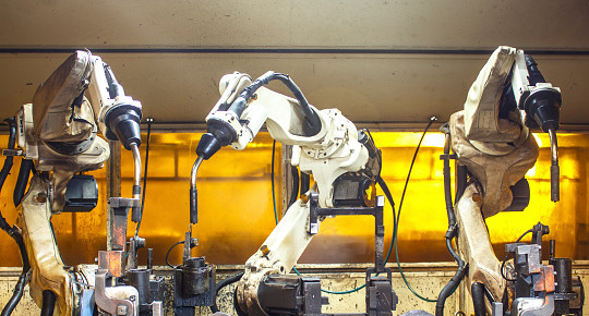 Robots two welding in factories industrial