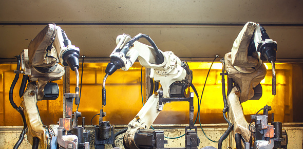 Robots two welding in factories industrial